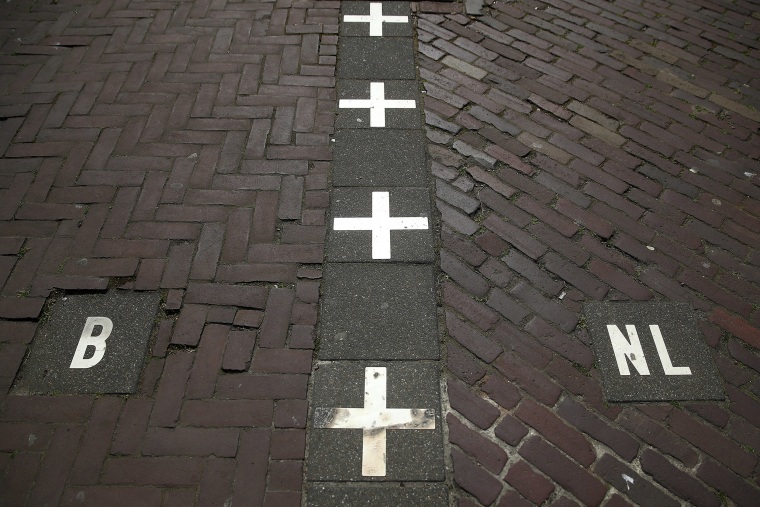 Image: A street in Baarle Nassau which is unique as it has many cross border points with Baarle-Hertog in Belgium allowing some businesses and private properties to be in both Holland and Belgium at the same time