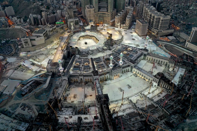Image: The Grand Mosque and Kaaba in the holy city of Mecca on May 24, 2020. Saudi Arabia began a five-day curfew on May 23 after coronavirus infections more than quadrupled since the start of Ramadan.