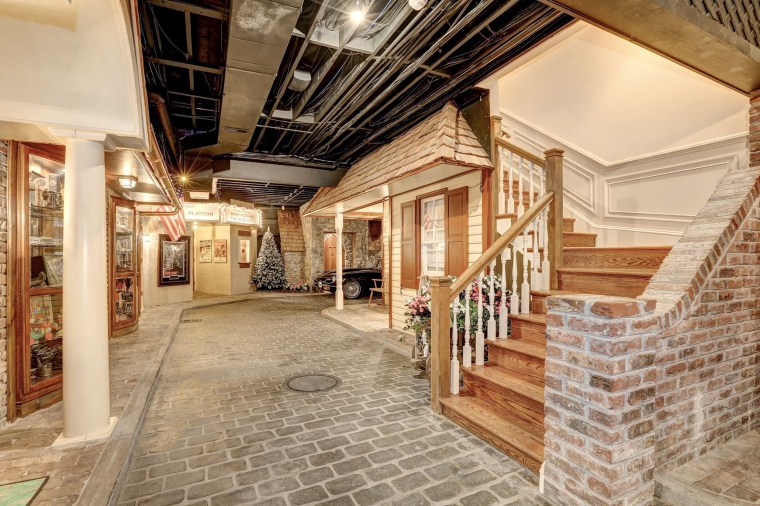 Wooden stairs lead into a "Turn of the Century" village. 