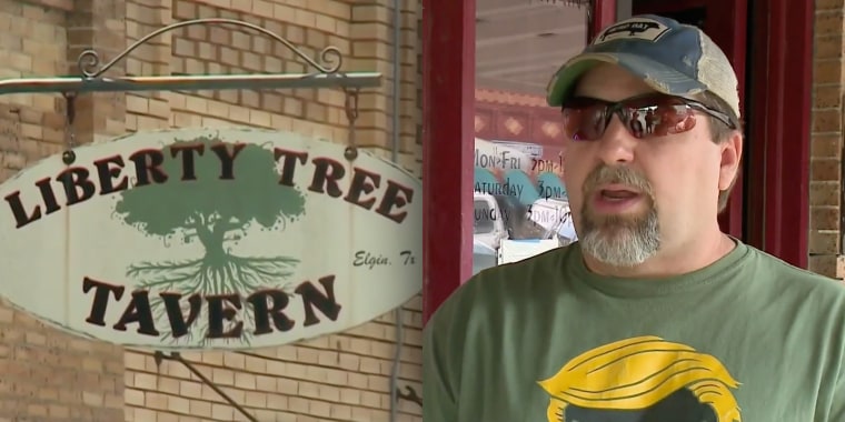 Kevin Smith, co-owner of Liberty Tree Tavern in Elgin, Texas, says customers are not allowed to wear masks in his bar. 