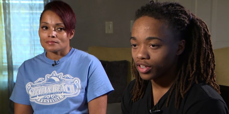 DeAndre Arnold speaks about his dreadlocks as his mother, Sandy, listens.