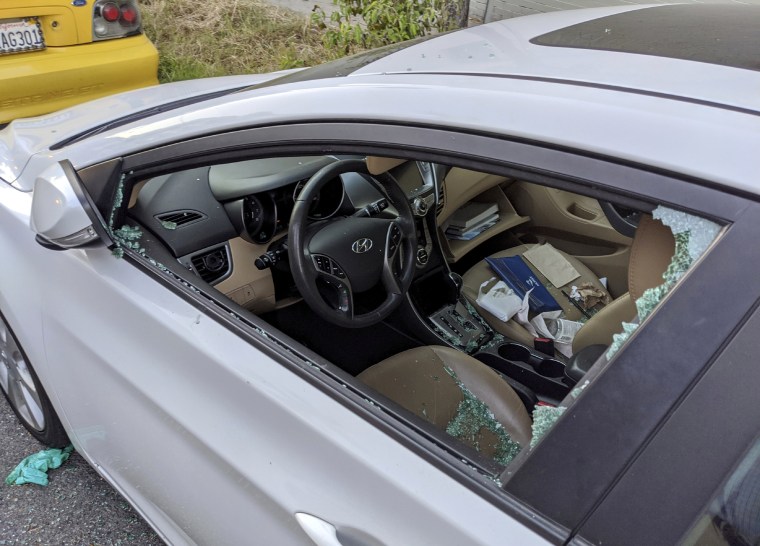 Image: A smashed window after a car was broken into on a street in Los Angeles on May 21, 2020.