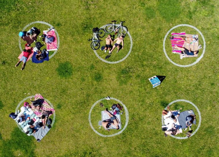 Image: People relax in social distancing circles at San Francisco's Dolores Park on May 24.