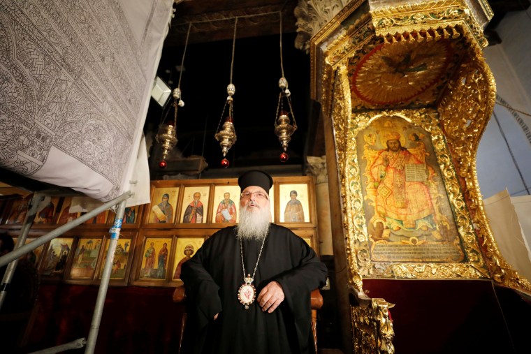 Image: The head of the Greek Orthodox Church in Bethlehem reopens the Church of the Nativity as Palestinians ease coronavirus restrictions on Tuesday.