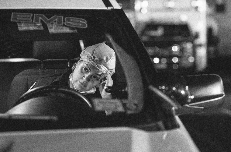 Image: Patricia Rodriguez, a paramedic, fills out reports after her 12-hour shift in Yonkers, N.Y., on April 6, 2020.