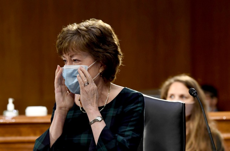 Image: Sen. Suasn Collins, R-ME, adjusts her mask before a committee hearing in Washington on May 12, 2020.