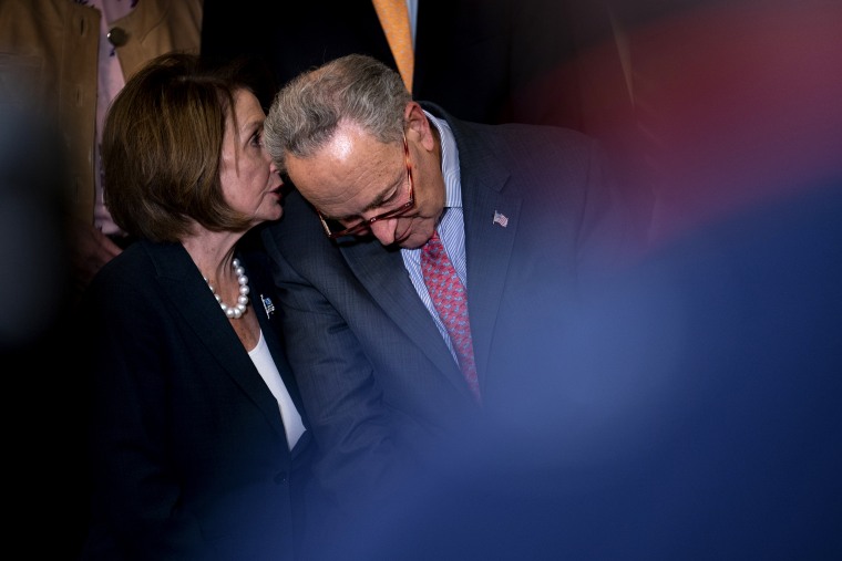 Image: House Speaker Nancy Pelosi speaks to Senate Minority Leader Chuck Schumer during a news conference at the Capitol on May 15, 2019.