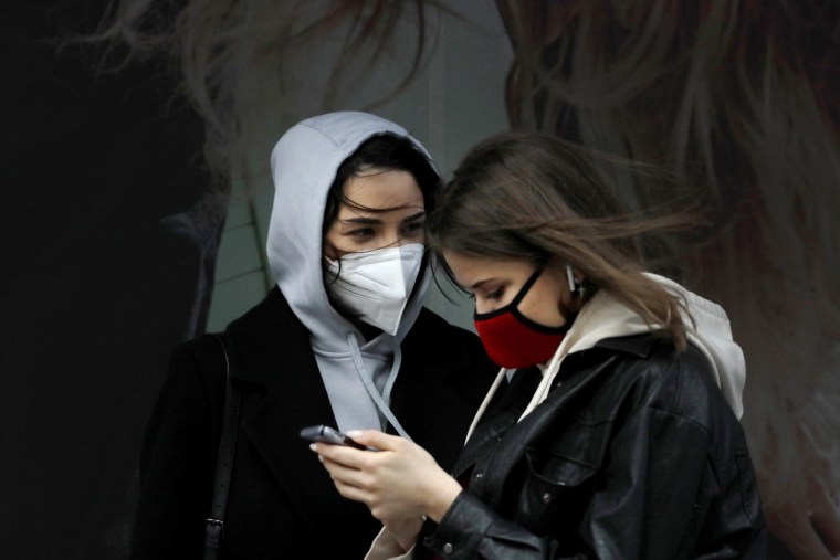 Image: Women wearing masks in New York's Times Square on April 9, 2020.
