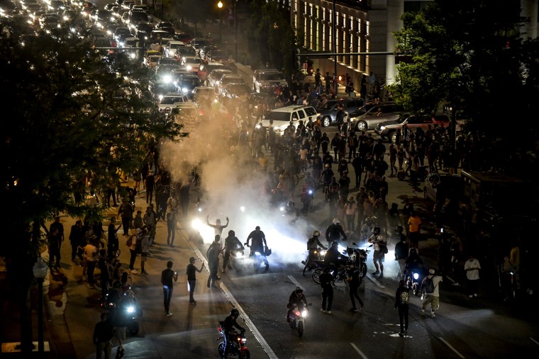 Image: People block traffic near the Colorado State Capitol during a protest demanding justice in the death of George Floyd in Denver on May 29, 2020.