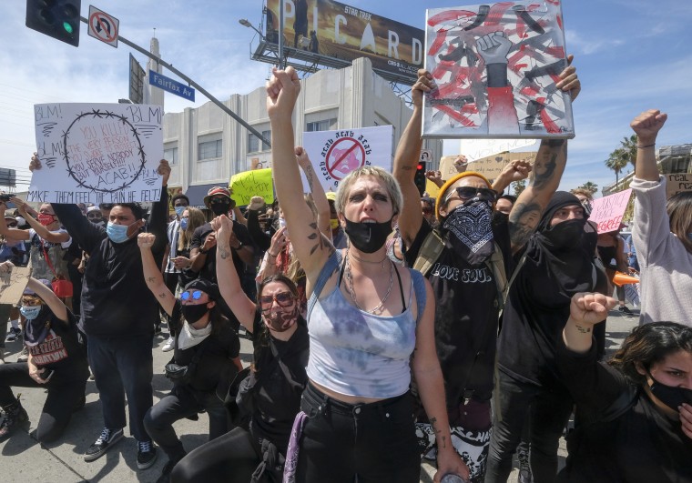 Demonstrators protest the death of George Floyd in Los Angeles on May 30, 2020.