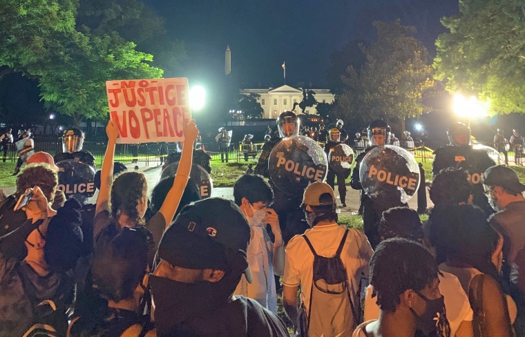 Police block protesters in front of the White House on May 30, 2020.