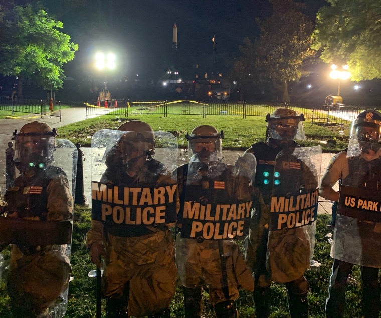 Military police guard the White House on Saturday, May 20, 2020.