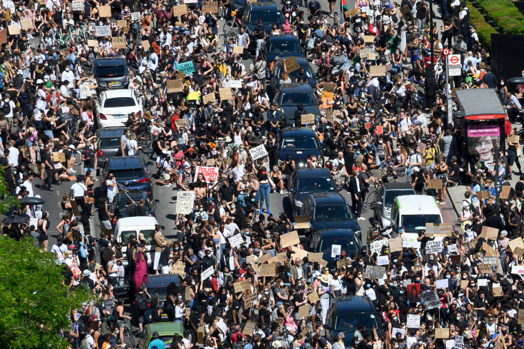 Image: Demonstrators block a road near the U.S. Embassy in London in protest over the death of George Floyd, an unarmed black man who died after a police officer knelt on his neck, on May 31, 2020.