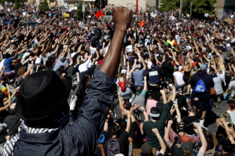 Image: Protesters raise their fist during a demonstration in Minneapolis on May 30, 2020.