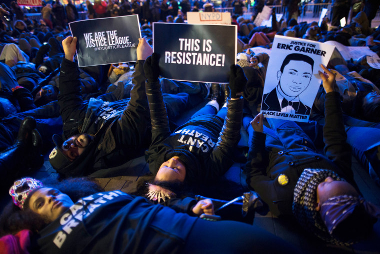 Image: Protesters participate in a "die-in" during a demonstration outside the Barclays Center