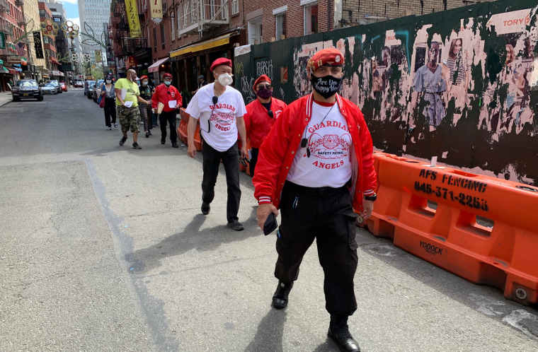 Guardian Angels walk down a street in NYC during the George Floyd protests. 