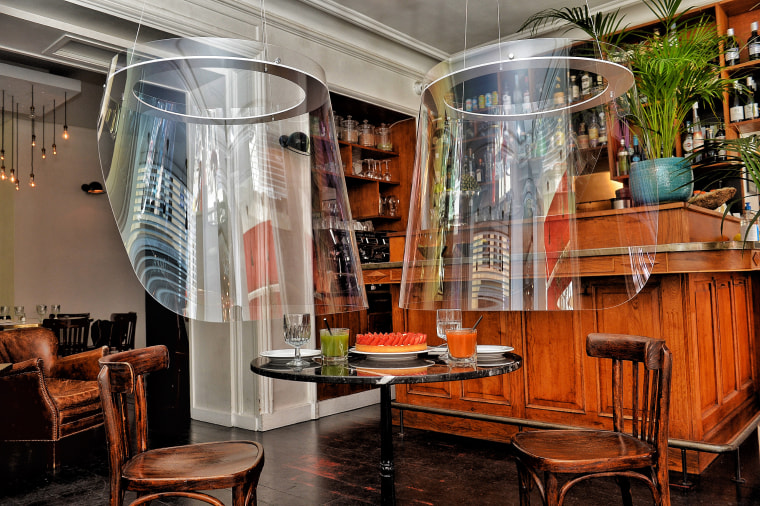 The shields are backless and hang from the ceiling.