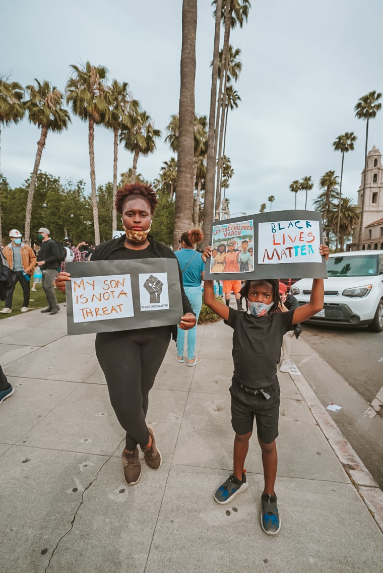 Karen Akpan at a Riverside, California protest following the death of George Floyd with her 7-year-old son, Aiden.