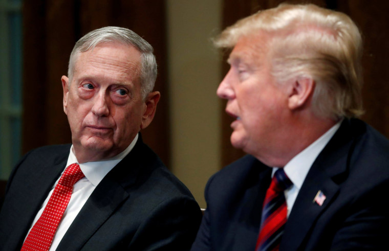 Image: Defense Secretary James Mattis listens as U.S. President Donald Trump speaks to the news media while gathering for a briefing from his senior military leaders