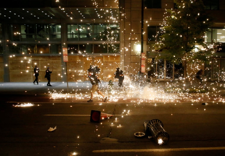 Image: People run as police disperse demonstrators during a protest amid nationwide unrest following the death in Minneapolis police custody of George Floyd, in Washington