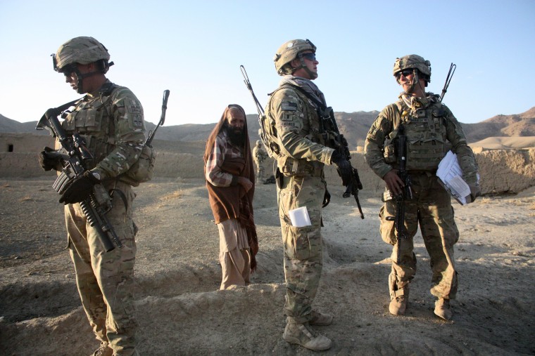 Image: Afghani And U.S. Soldiers Patrol Afghan Villages