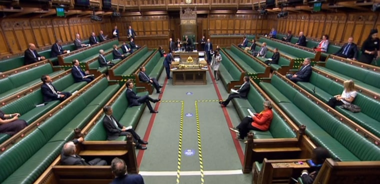 Image: Members of parliament spaced out on the benches in the House of Commons in London on June 2, 2020 to maintain social distancing as parlaiment reconvened.