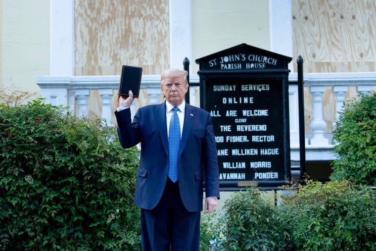 Image: President Donald Trump holds a Bible while visiting St. John's Church across from the White House after the area was cleared of people protesting the death of George Floyd