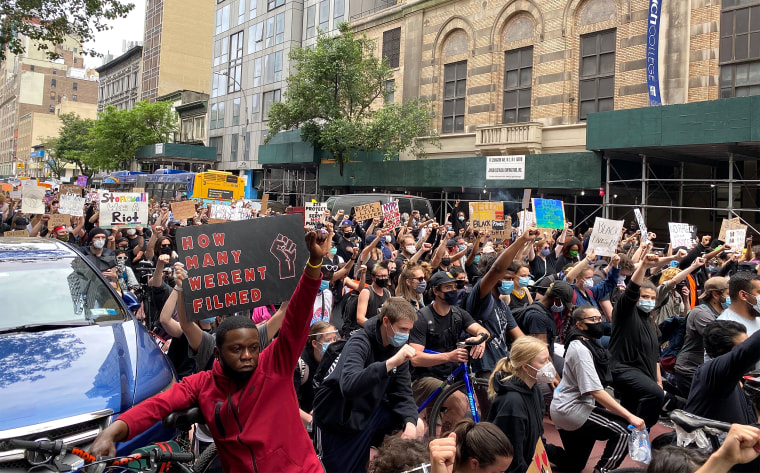 Protesters in lower Manhattan kneel in the middle of 23rd St between 3rd Ave and Park as part of a march on the afternoon of June 2, 2020.