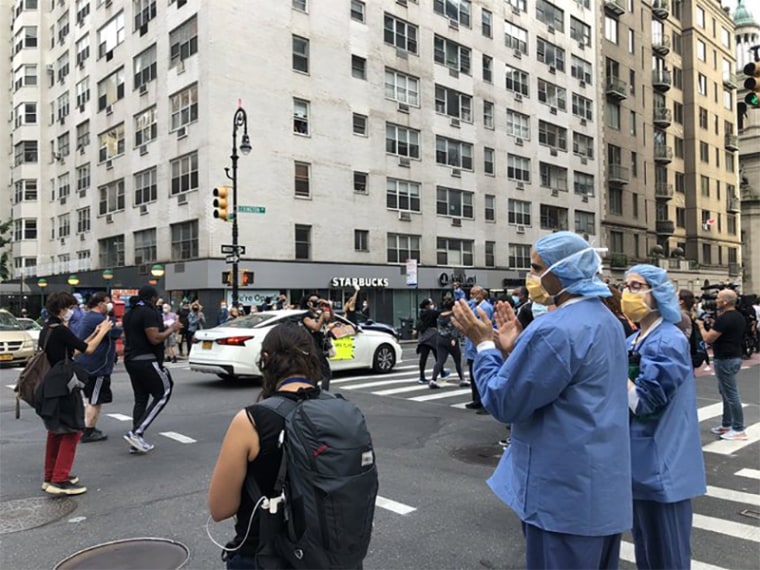 Image: Hospital workers cheer on protesters in NYC
