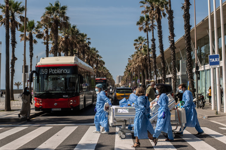 Image: Hospital patient Isidre Correa is taken to the seaside by intensive heath care staff outside the Hospital del Mar on June 3, 2020 in Barcelona, Spain.