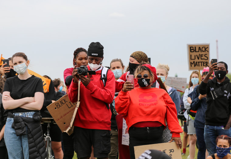 American citizen Vula Malinga, center right, protests in London on Wednesday. 