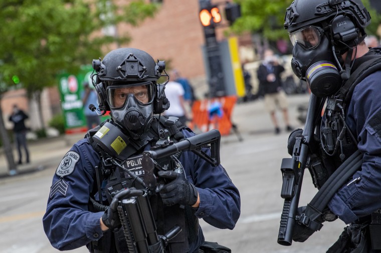 Police prepare to fire nonlethal projectiles just after the 7 p.m. curfew in Grand Rapids, Mich., on Monday, June 1, 2020.