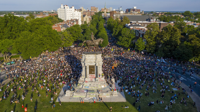 Image: A large group of protesters gather around the statue of Confederate General Robert E. Lee on Monument Avenue near downtown Tuesday, June 2, 2020, in Richmond, Va.