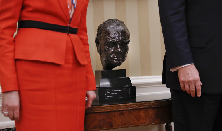Image: A bust of Winston Churchill sits between President Donald Trump and British Prime Minister Theresa May in the Oval Office of the White House.