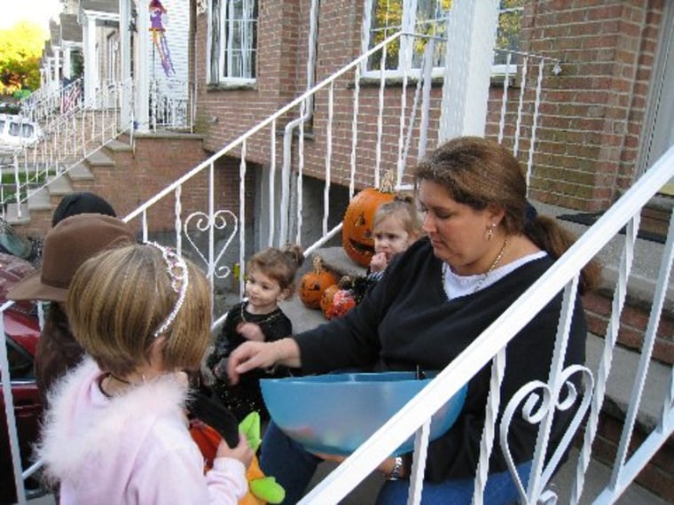 Image: Sharon handing out candy on Halloween on the front steps of the family home in Staten Island in 2008.