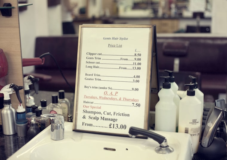 Price list in barbershop, close up