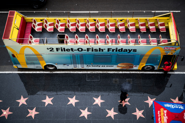 Image: An empty tour bus near the walk of fame in Hollywood, Calif., on March 13, 2020.