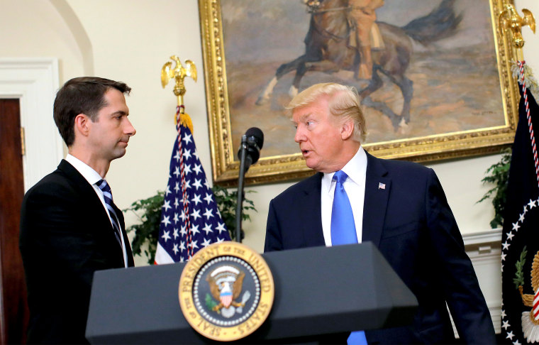 U.S. President Donald Trump leaves after delivering remarks on immigration reform, accompanied by Senator Tom Cotton in the Roosevelt Room of the White House in Washington