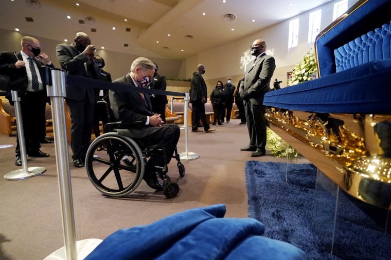 Image: Texas Gov. Greg Abbott pays his respects at the casket of George Floyd in Houston on June 8, 2020.