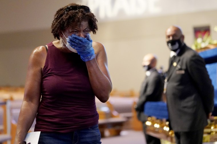 Image: Charlene Thompson cries as she passes the casket of George Floyd in Houston on June 8, 2020.