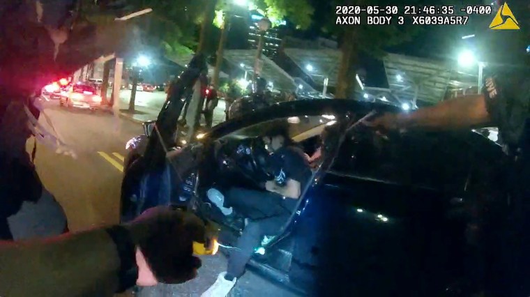 Image: Still frame from Atlanta Police Department bodycam video footage of police officer Ivory Streeter, shows car driver Messiah Young being shot by a taser, during ongoing protests against the death in Minneapolis police custody of George Floyd, in Atl