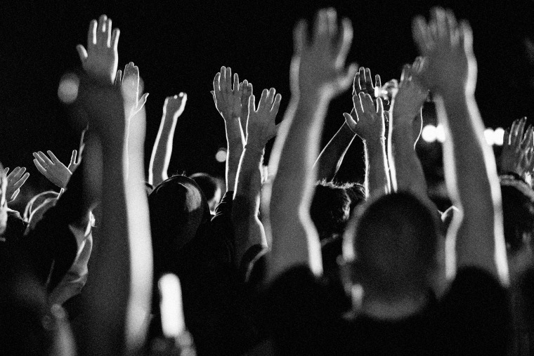 Image: Demonstrators raise their hands at a protest outside of the White House on May 31, 2020.