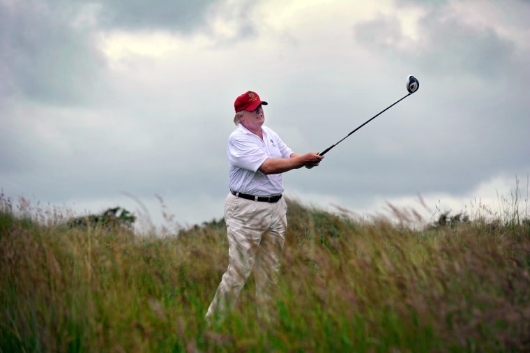 Image: Donald Trump plays a stroke as he officially opens his new multi-million pound Trump International Golf Links course in Aberdeenshire, Scotland
