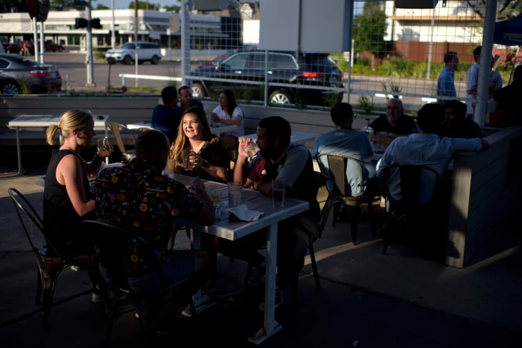 Image: People get together for drinks at Eight Row Flint in Houston, Texas, on May 22, 2020.