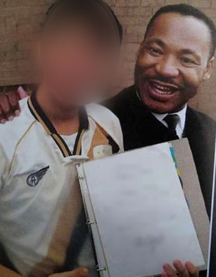 The photograph of the student posing with Dr. Martin Luther King Jr. while holding a sheet of paper that reads "Official N-word Pass."