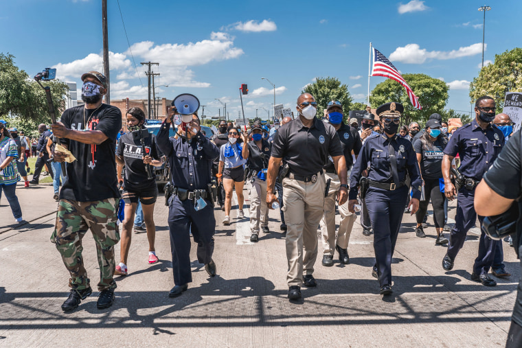 Black and Latino officers participate in a march to show their support for Black Lives Matter in Dallas on June 5.