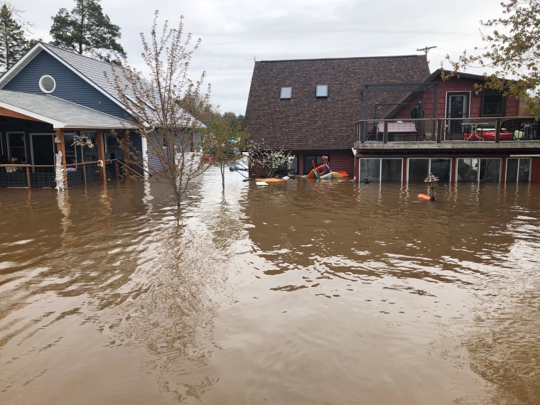 The Schulz and Lackey cottages during the flooding.