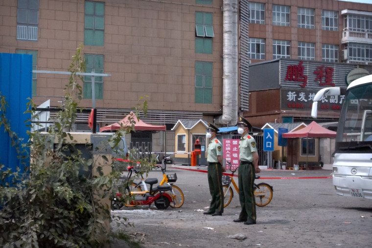 Image: Police at Xinfadi market in Beijing