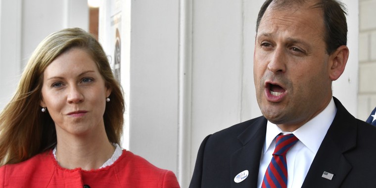 Rep. Andy Barr and his wife, who went by Carol, speak with reporters outside his polling place in Lexington on Nov. 6, 2018. 