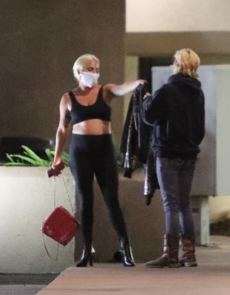Lady Gaga gives her leather jacket to a fan in Malibu
